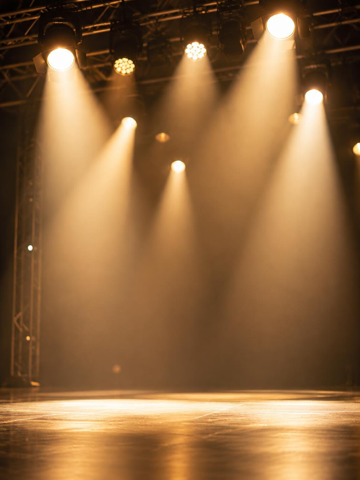 Stage spotlights shining over a performance stage