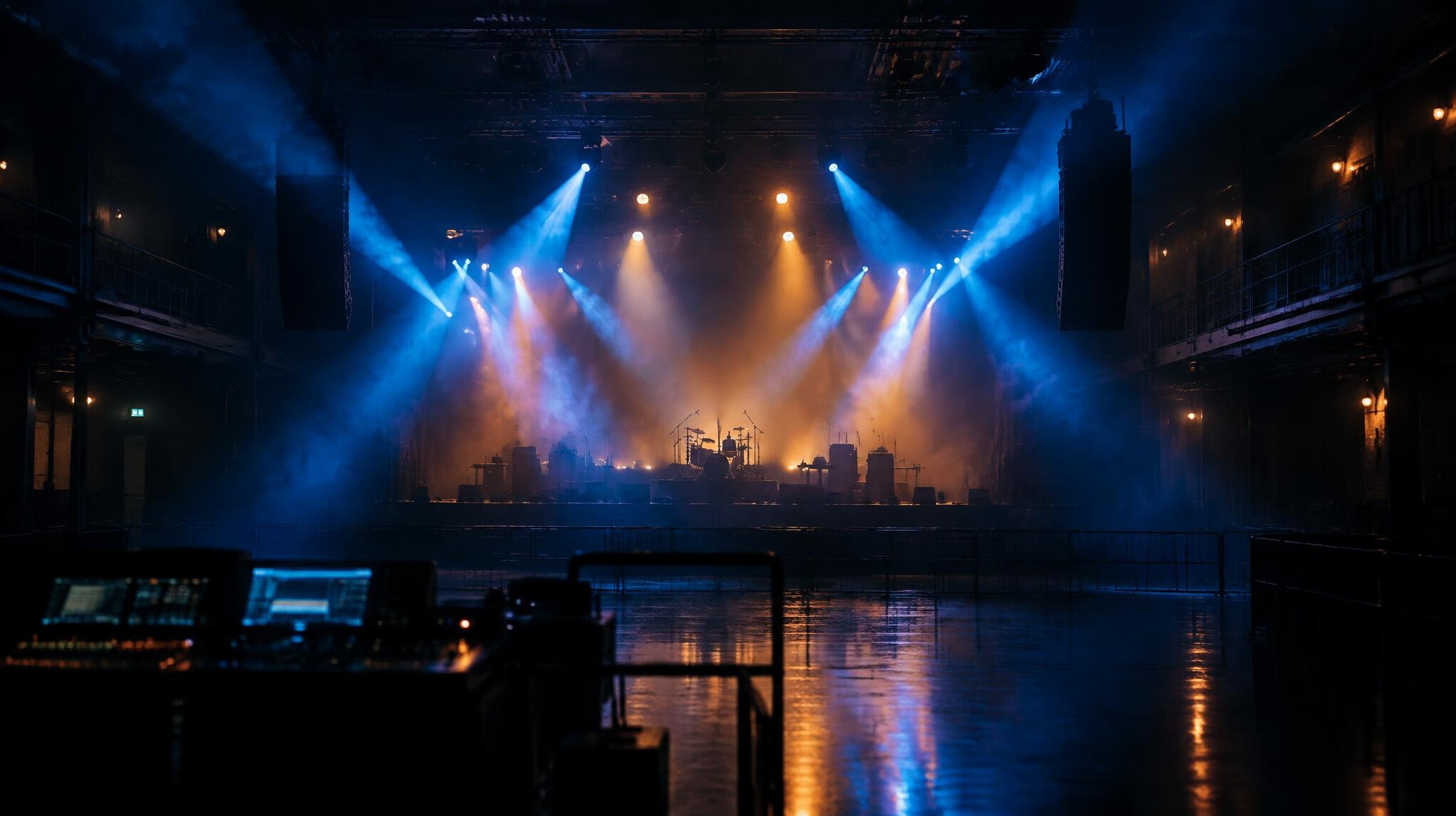 Dark production control area with glowing stage lights